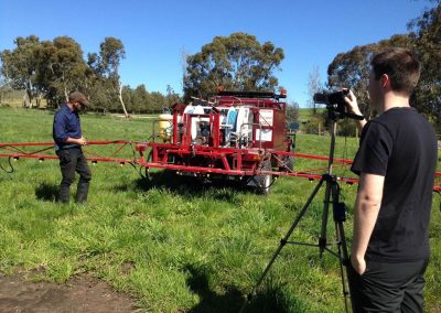 A Wrenhaven technician spraying using a back pack and weed spraying tool in areas where big weed spraying machines cannot reach in South Australia